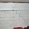 A buckling foundation wall in a Wilson home.