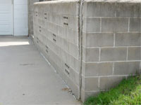 A retaining wall separating from the adjoining walls in Edgerton