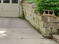a failing retaining wall around a driveway in Sheridan