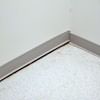 A partition wall separating from the floor in a Mills home.