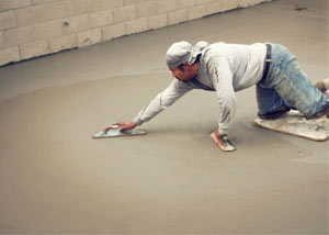 smoothing out the grout in a slab releveling project in Green River