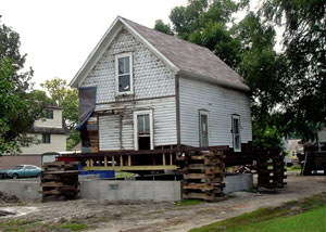 A severely damaged home foundation that is undergoing replacement in Thermopolis.