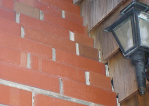 a repaired chimney in Powell that had shown serious foundation damage and was repaired with a helical pier system.