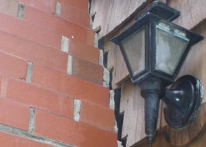 A tilting chimney in Powell showing serious foundation damage.