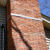 A tilting chimney on a Alcova home with a leaning, tilting chimney that was temporarily repaired.