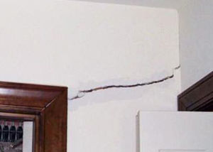 A large drywall crack in an interior wall in Sheridan