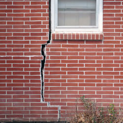 A foundation with a large crack that's wider at the top than on the bottom in Parkman