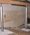 A system of crawl space support posts adding structural support to a crawl space in Clearmont