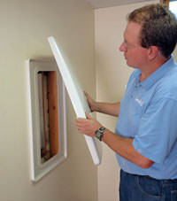 wall anchor covers installed in a foundation repair for a Mills home.