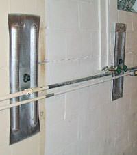 A foundation wall anchor system used to repair a basement wall in Wilson
