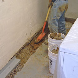 Digging a trench for a French Drain system in Sheridan