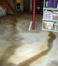 Flooding entering a basement through a floor crack in Mills