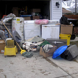 Soaked, wet personal items sitting in a driveway, including a washer and dryer in Green River.