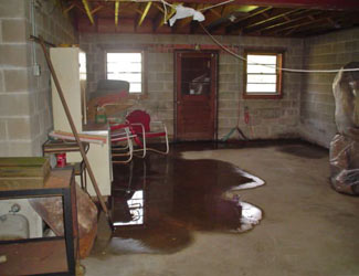 a flooded basement floor in a Clearmont home