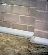 Our baseboard drain system installed on a corner in a Riverton basement.