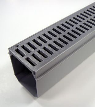 A closeup of our grated basement drainage pipe system, installed in Worland