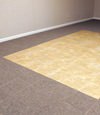tiled and carpeted basement flooring installed in a Laramie home