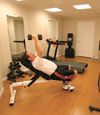 a basement gym and workout room with a wood laminate flooring, installed in Rock Springs, WY