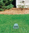 A buried gutter drain downspout extension installed in a Clearmont home