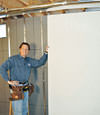 Installing wall panels on top of our basement wall insulation in Green River