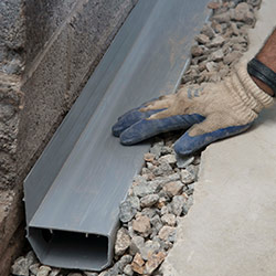 installing a drain tile system in a Wilson home